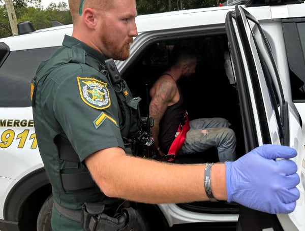 Deputies arrested a Florida man wanted for aggravated assault Tuesday after it was found he threatened a woman and her children with a firearm.
