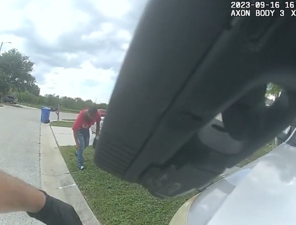 The body-cam footage of an intense standoff with a 14-year-old murder suspect in Florida has been released.