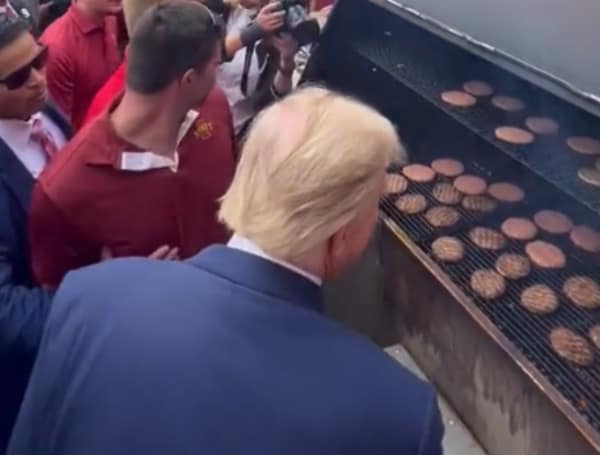 Former President Donald Trump showed up to a fraternity’s tailgate party before a college football game Saturday.