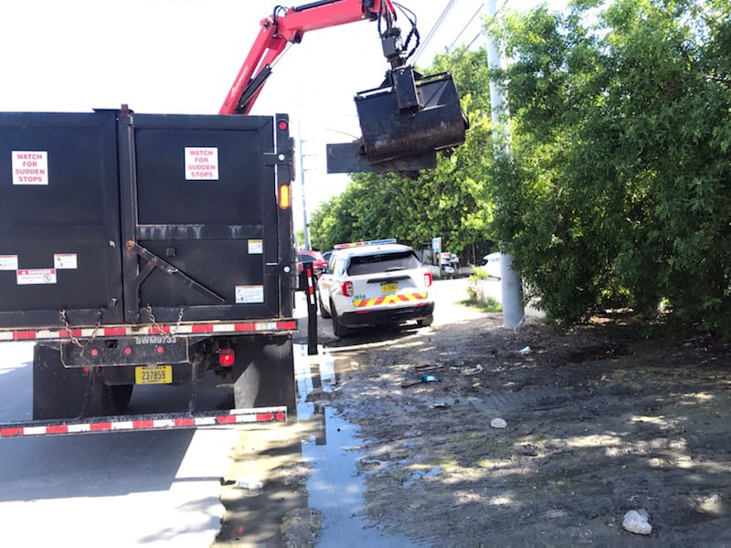 A 29-year-old Florida man was arrested Friday in connection with approximately 1,400 pounds of trash left on the side of a street. 