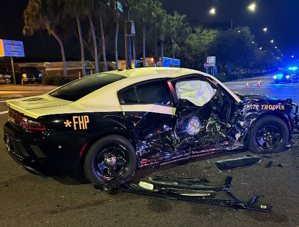 LAKELAND, Fla. - A 20-year-old Lakeland man was arrested after running a red light and crashing into a Florida Trooper.