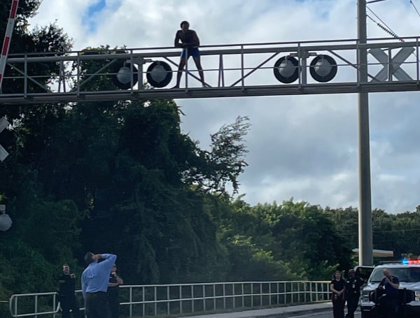 LAKELAND, Fla. -The man who climbed up and onto the railroad crossing over the northbound lanes of Combee Road in Lakeland, causing CSX operations and Combee Road to be shut down for approximately 10 hours Sunday, has been arrested.