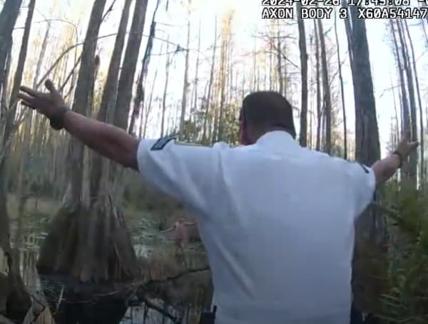 The moment was caught on camera when deputies found a lost child with Autism in a swamp. (HCSO)