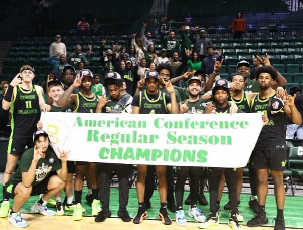Bulls celebrate conference title after win at Charlotte (Credit: USF Athletics)