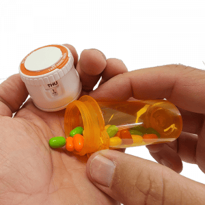 20707674 meticap pouring pills 300x300 1