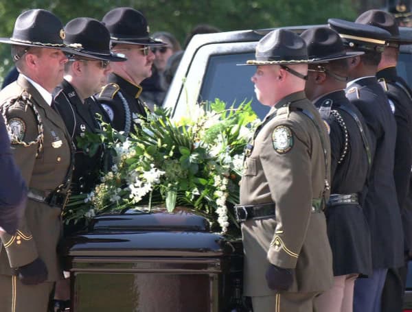 An honor guard carries the casket of former Gov. and U.S. Sen. Bob Graham. By Mike Exline, NSF