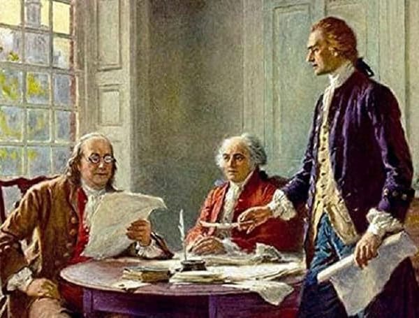 John Adams Thomas Jefferson and Benjamin Franklin gather to draft the Declaration of Independence in 1776 (National Archives)